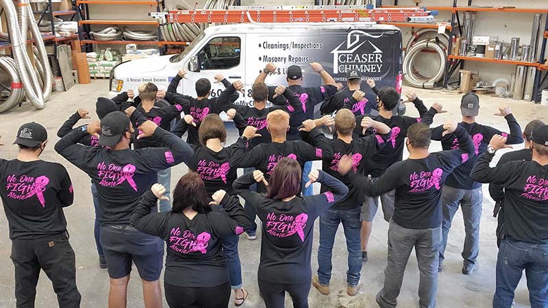 Ceasar Chimney wearing Sweep Away Cancer shirts